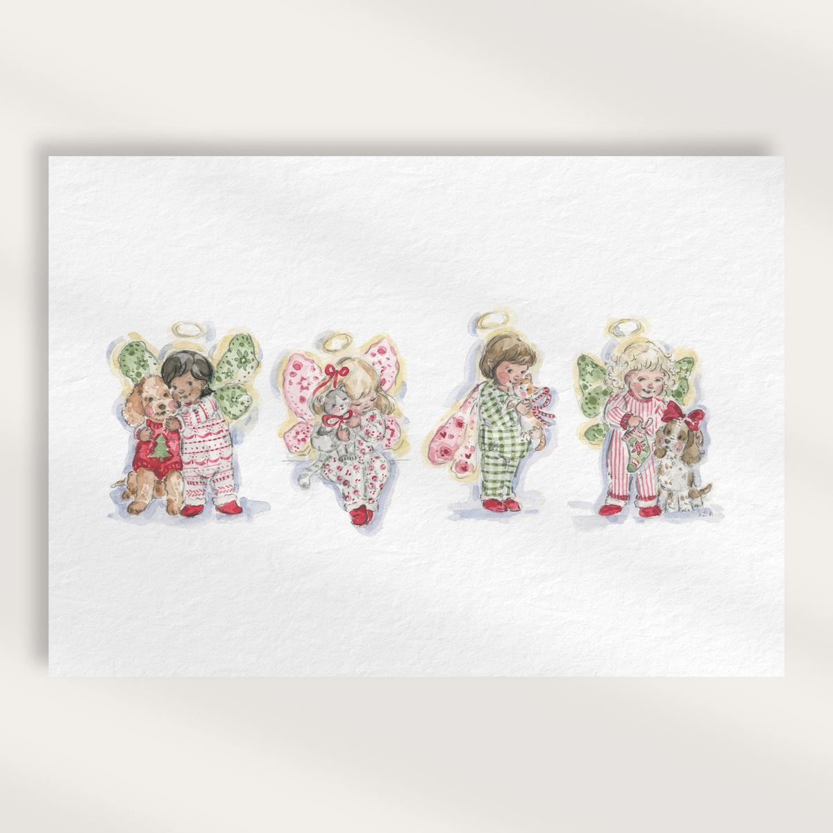 A watercolor-style art print featuring four children dressed as angels in colorful pajamas, displayed on a textured white card against a warm beige background.
